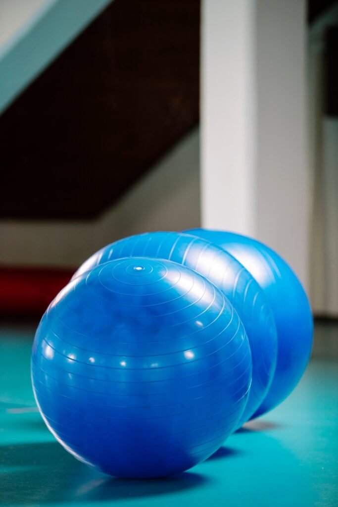 Group of blue pilates balls in the gym